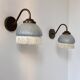 Pair of vintage wall lights in brass and blue-tinted glass, France 1970.