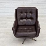 1970s, set of two swivel lounge chairs with footstool, leather.
