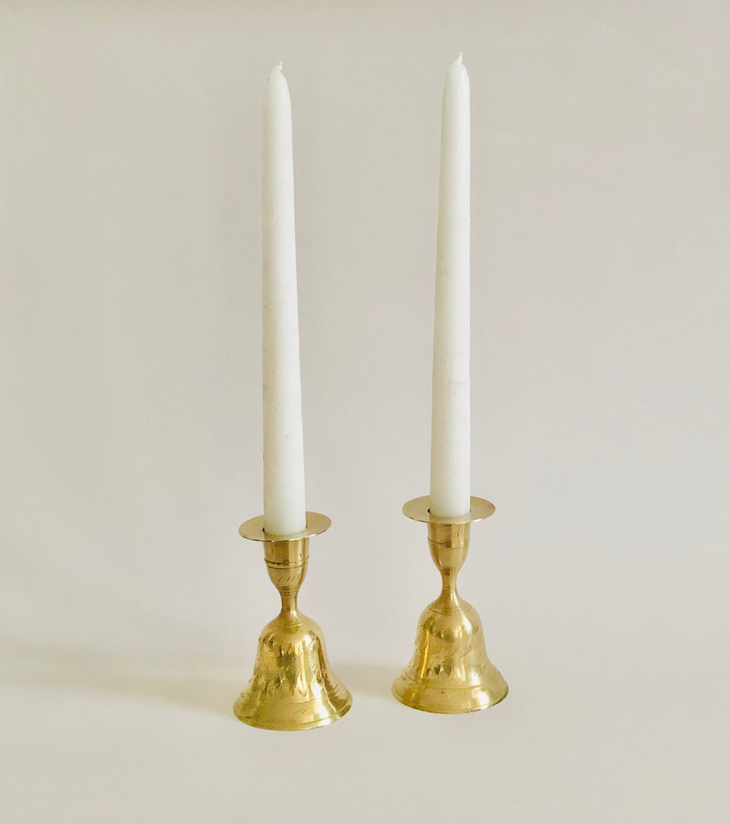Pair of brass "bell" candle holders