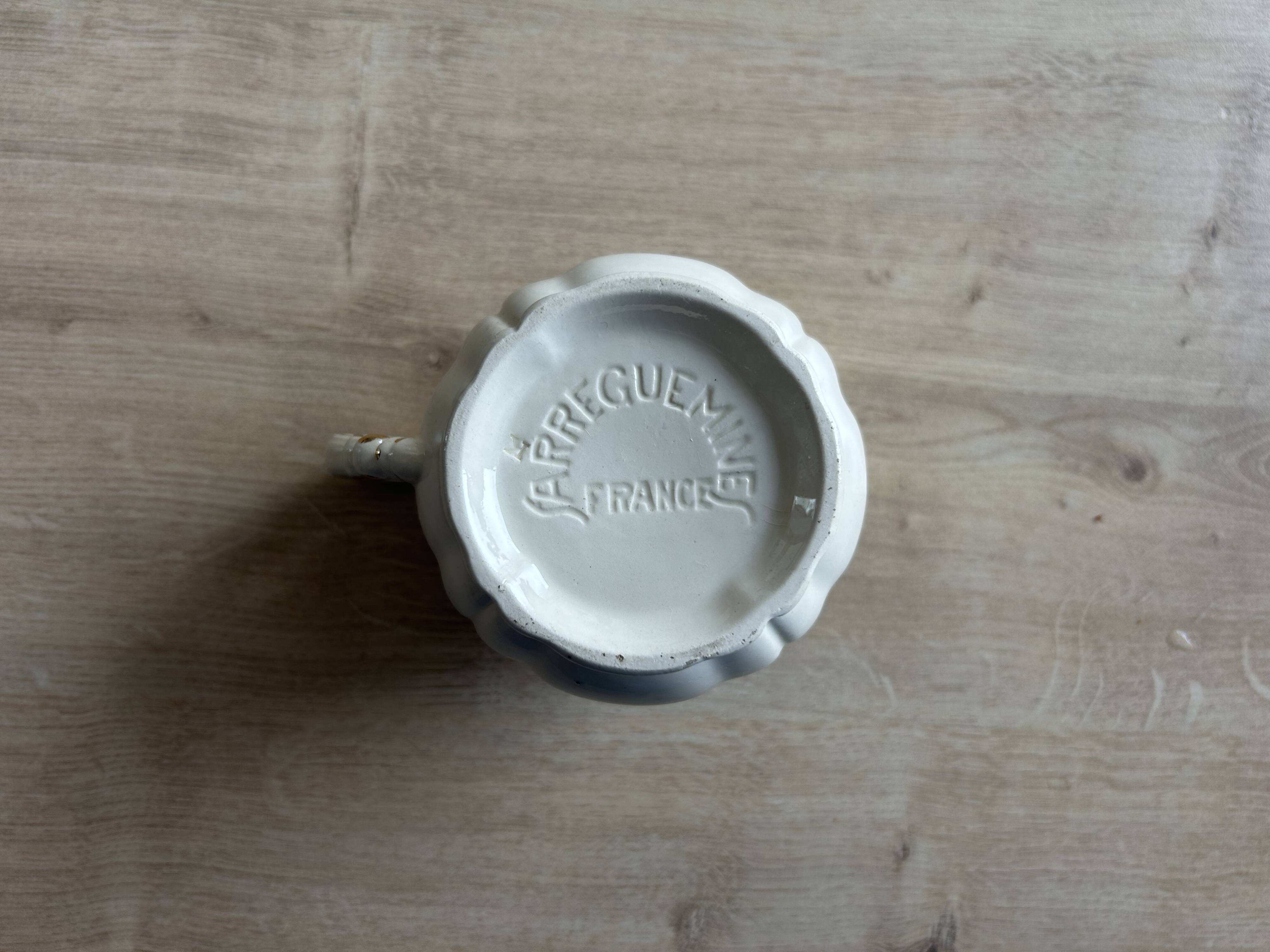 Old cream jug "Nous deux" in Sarreguemines earthenware.