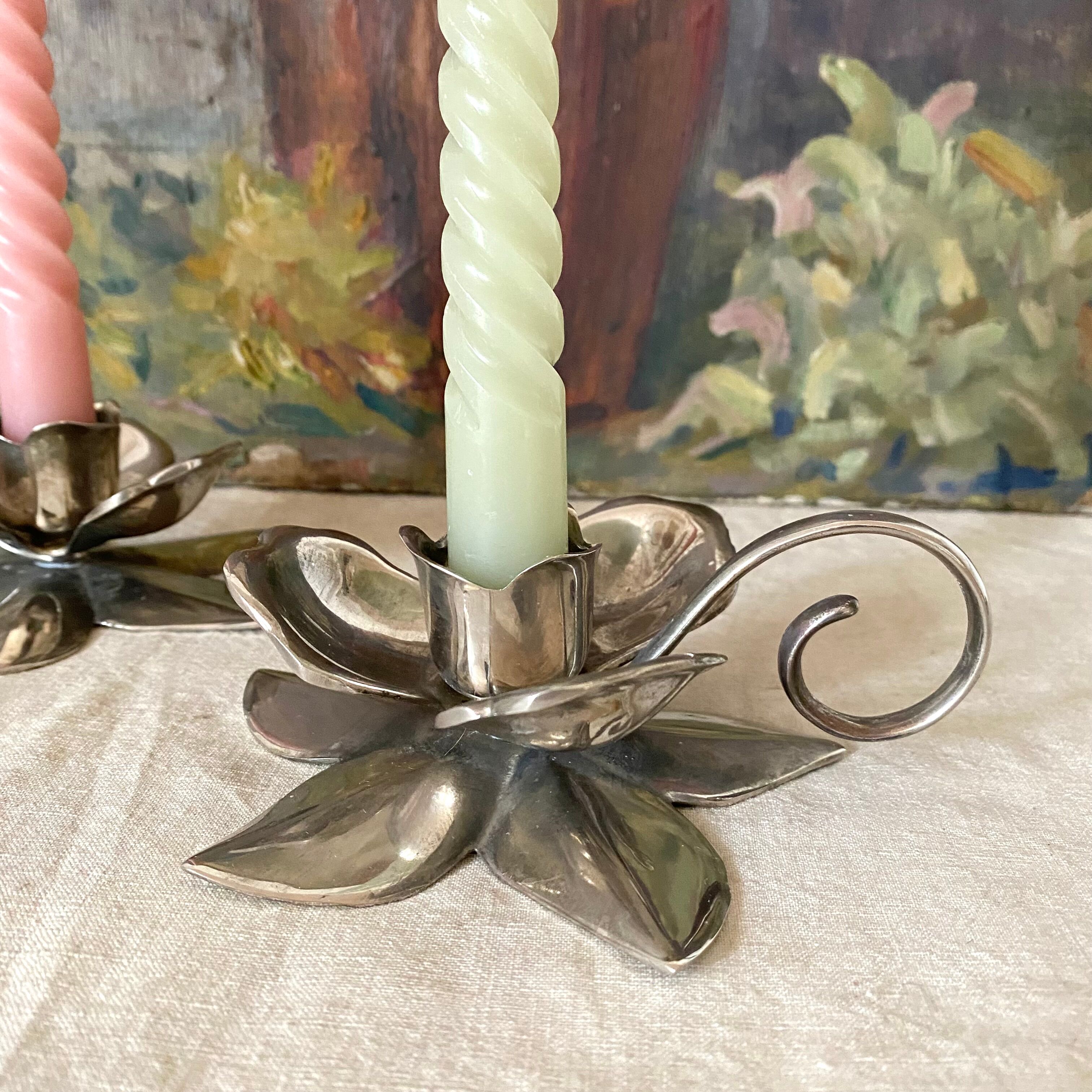 Pair of silver metal flower candle holders