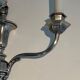 A pair of important Louis XVI style silver-plated wall sconces with three light arms.