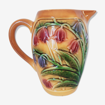 Pitcher orange flowers in relief