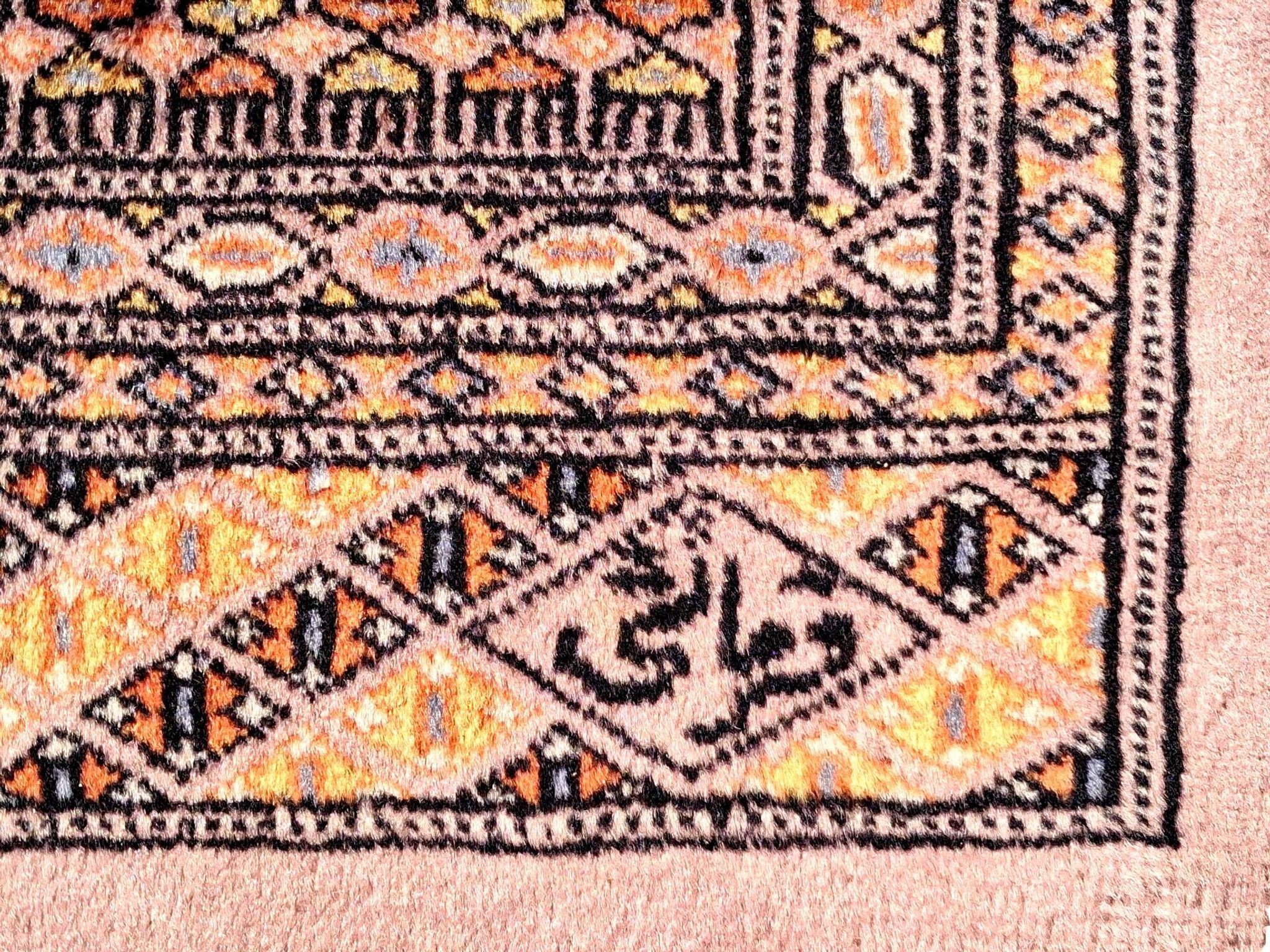 Oriental rug, size 243 x 168 cm, signed and numbered.