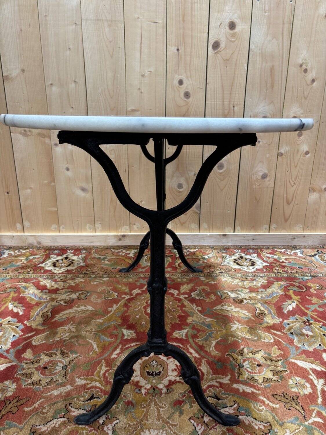 Authentic bistro table with white marble and cast iron from the early 20th century.