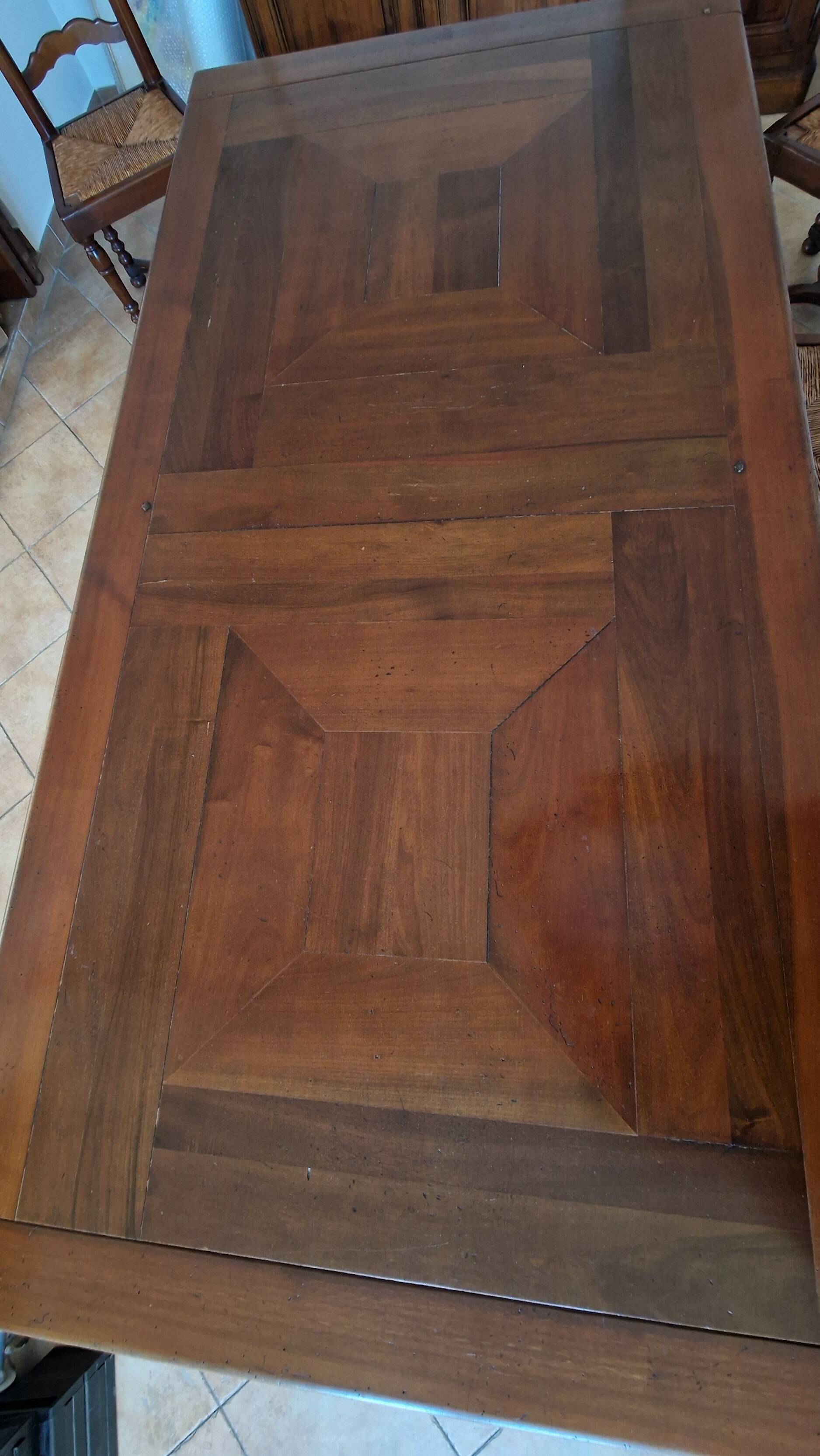 Marquetry wooden dining table with its 6 chairs.