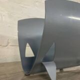 Designer log holder in enameled sheet metal