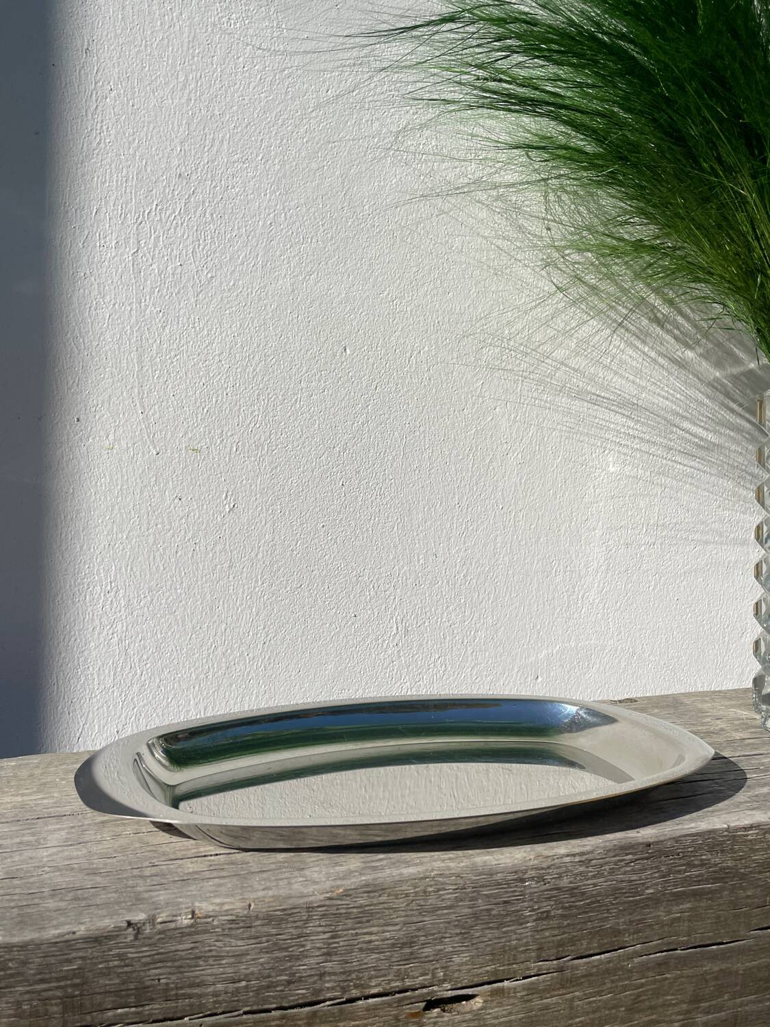 Oval stainless steel dish signed Rémi Letang