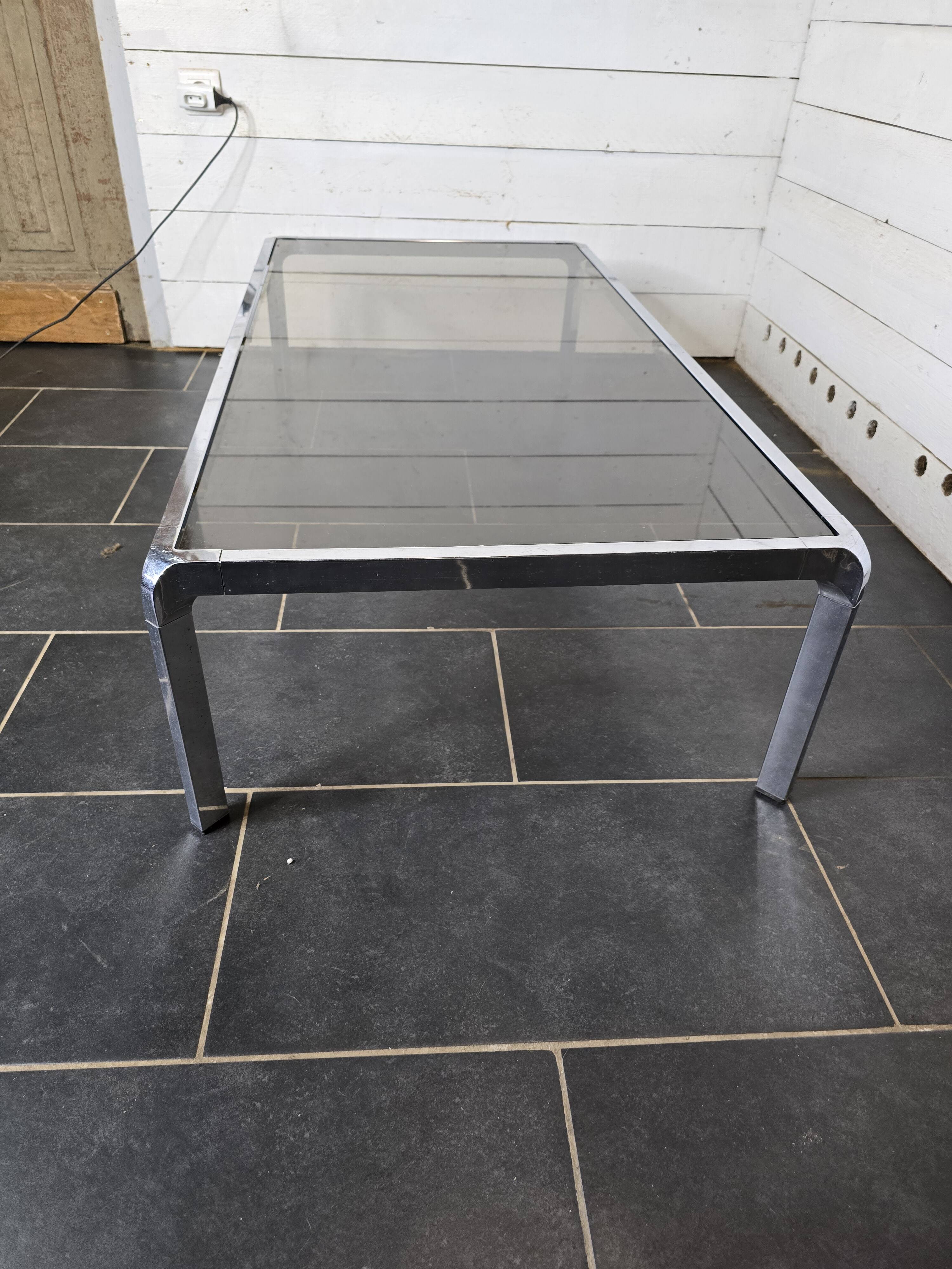 Chromed metal coffee table with smoked glass top from the 70s