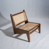 Reclined armchair in canned teak in natural wood