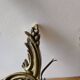 Pair of symmetrical gold wall sconces in baroque style made of bronze.
