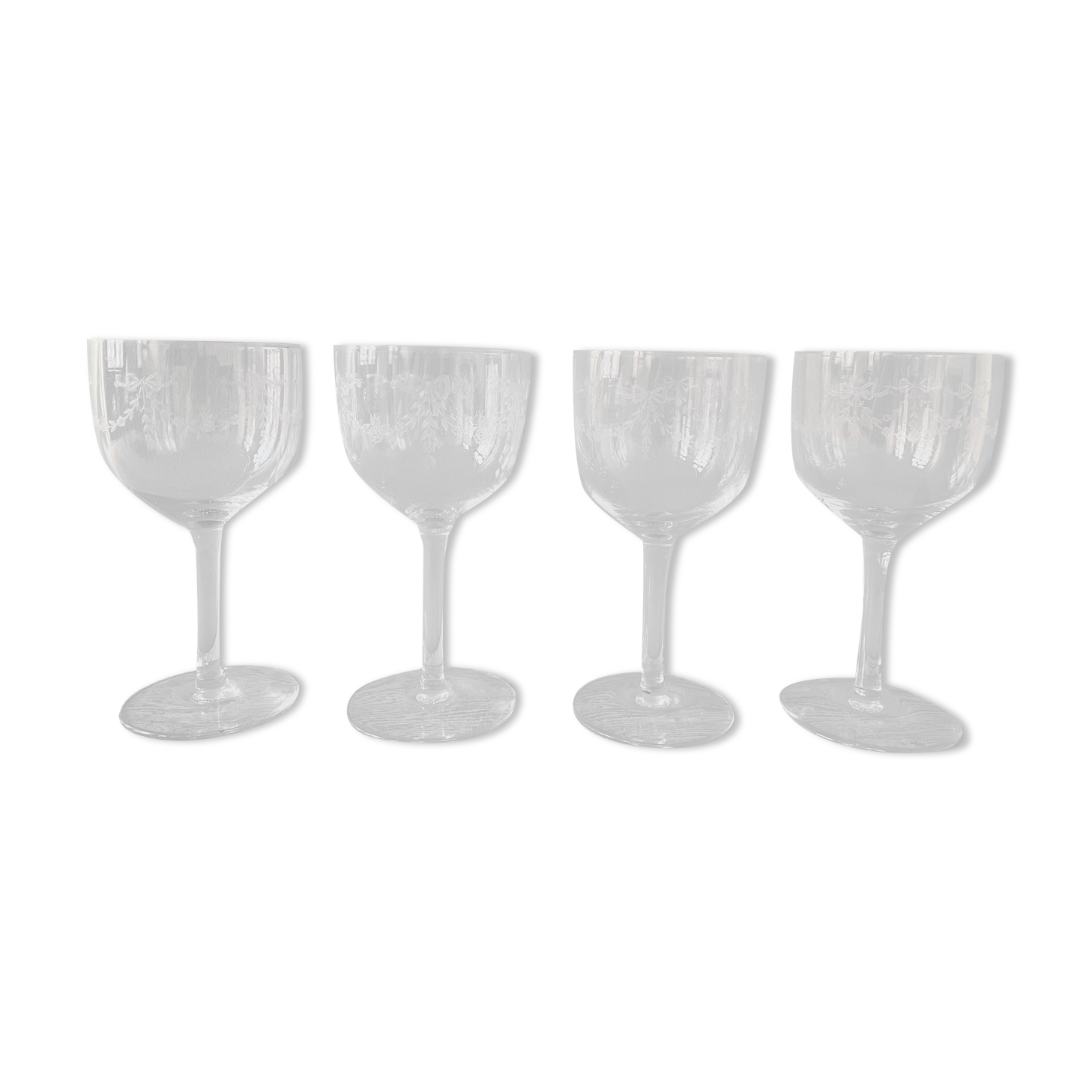 Set of 4 antique chiseled crystal foot glasses