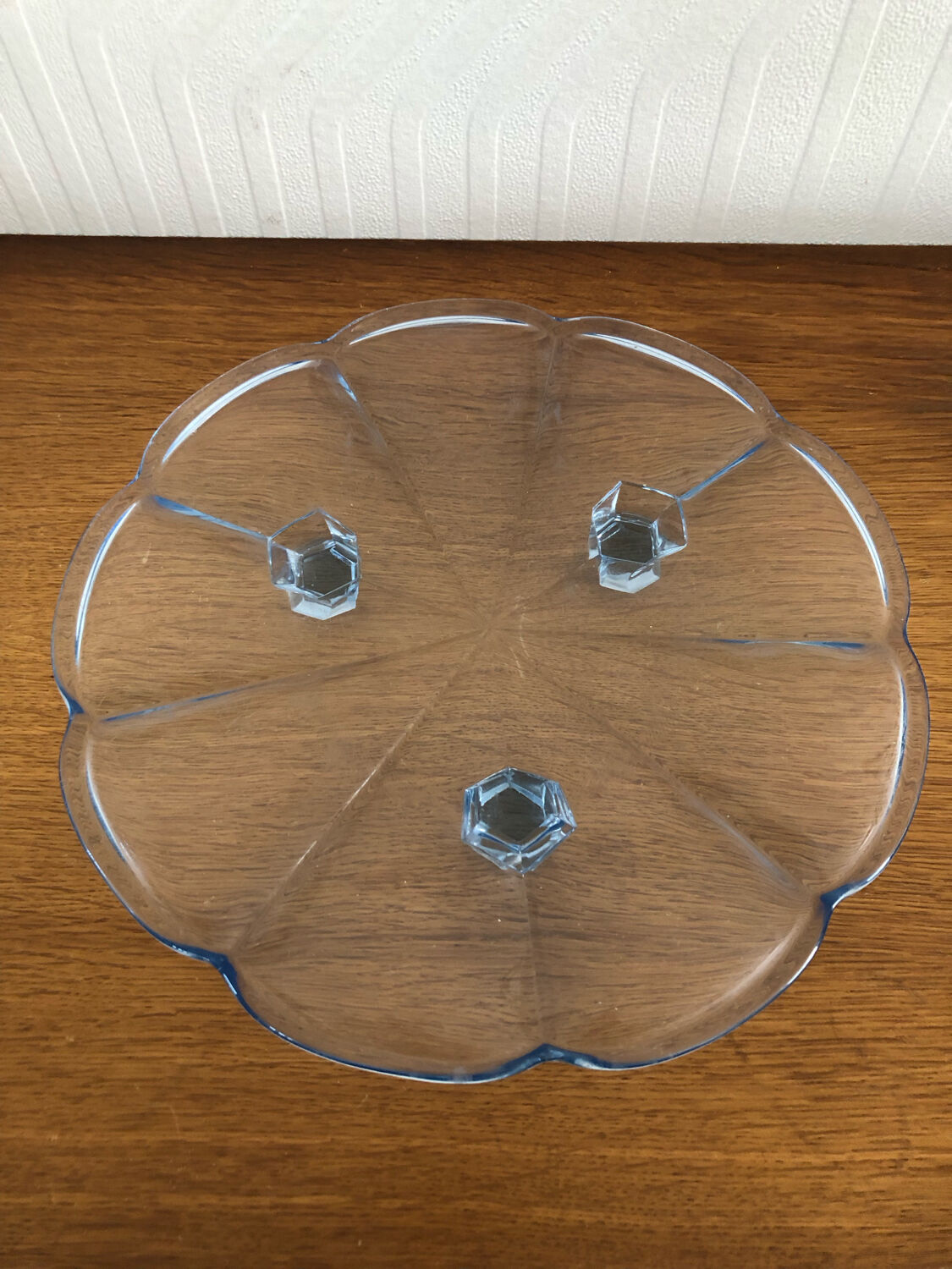 Blue transparent glass pie dish on vintage stand