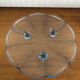 Blue transparent glass pie dish on vintage stand