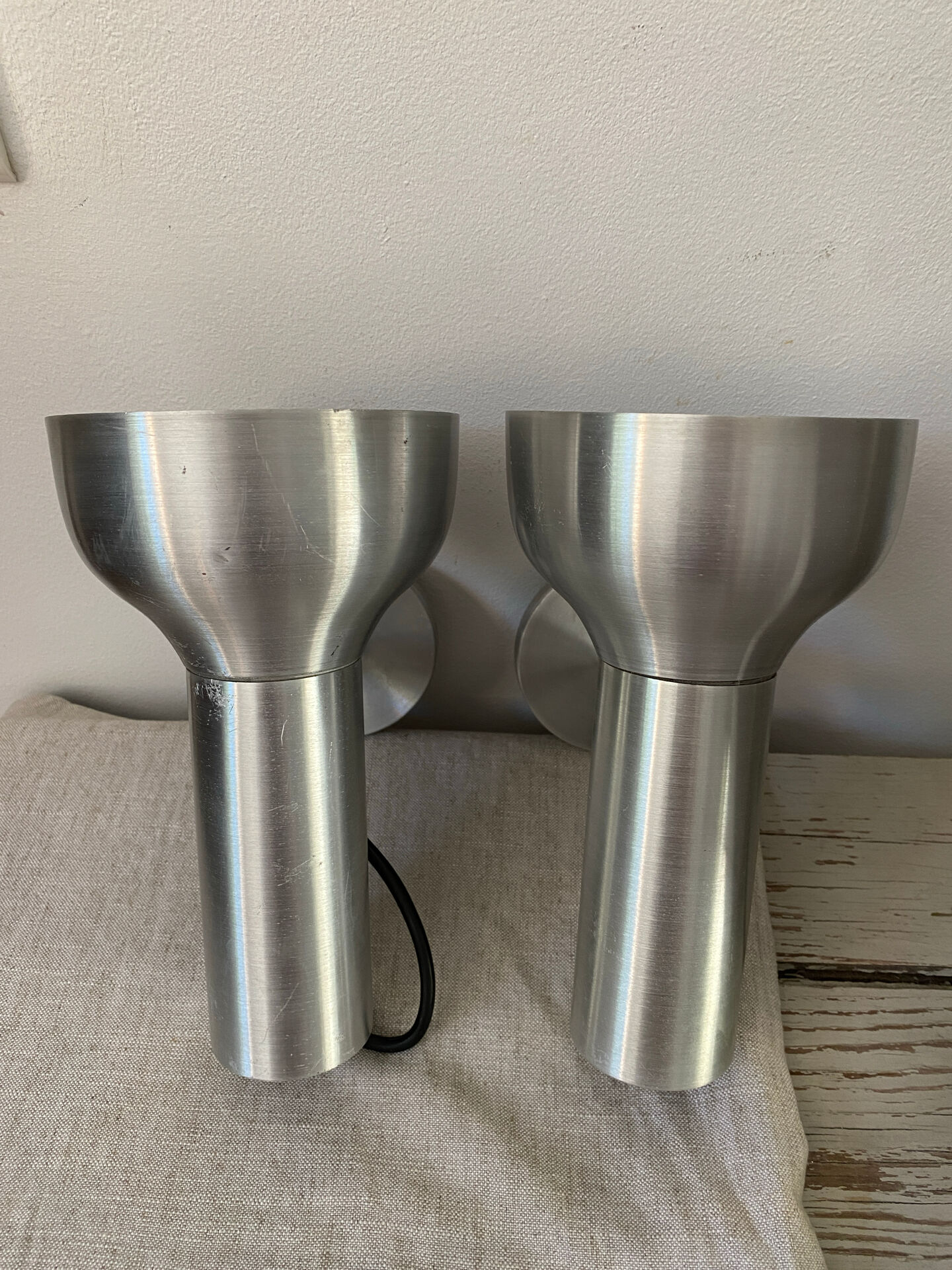 Pair of brushed metal wall sconces