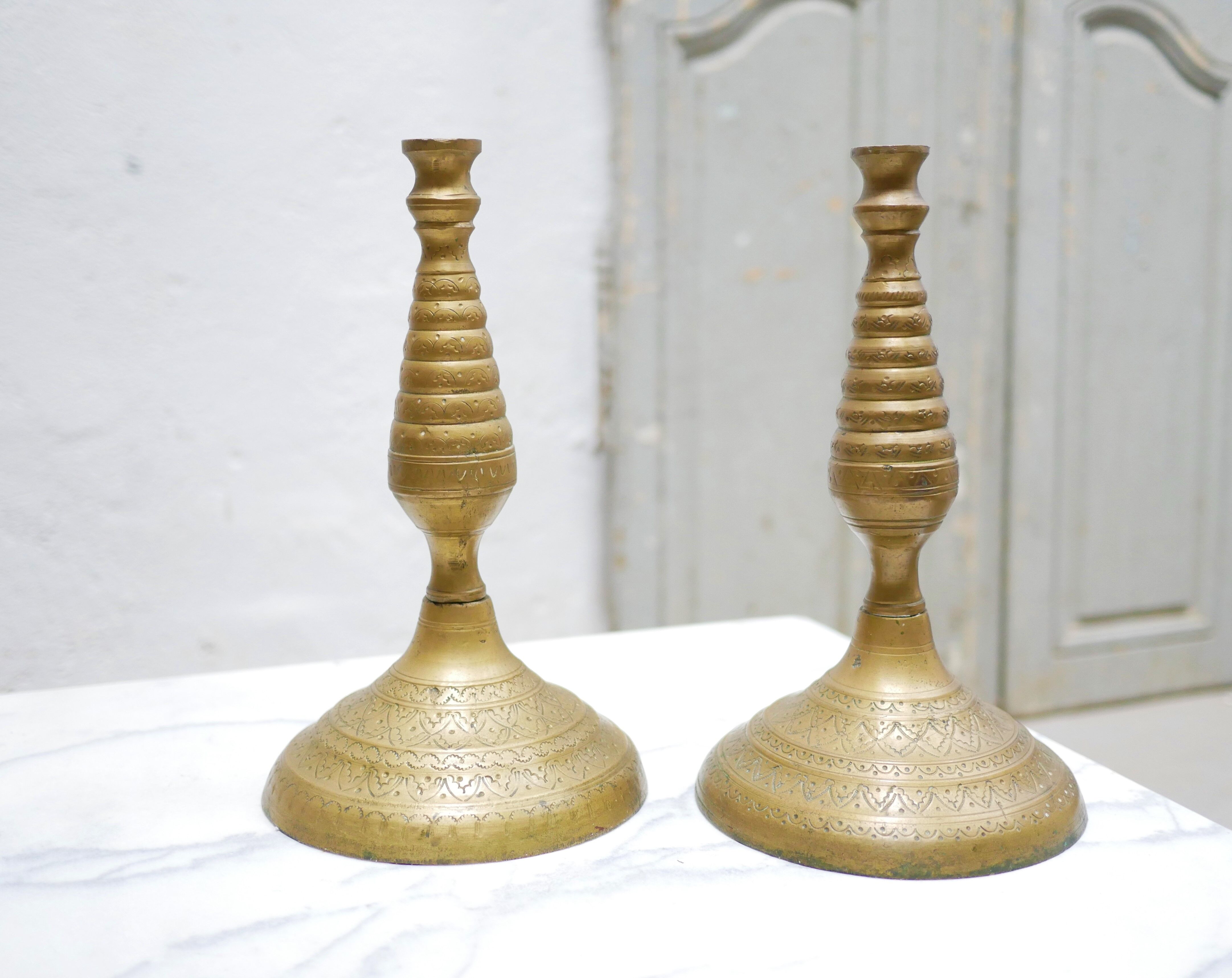 Pair of vintage candle holders in golden brass