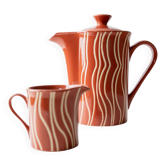 Vintage tea or coffee service in 1970s ceramic, teapot with lid and milk jug, rust orange with retro striped pattern, mid-century decoration, gift idea.