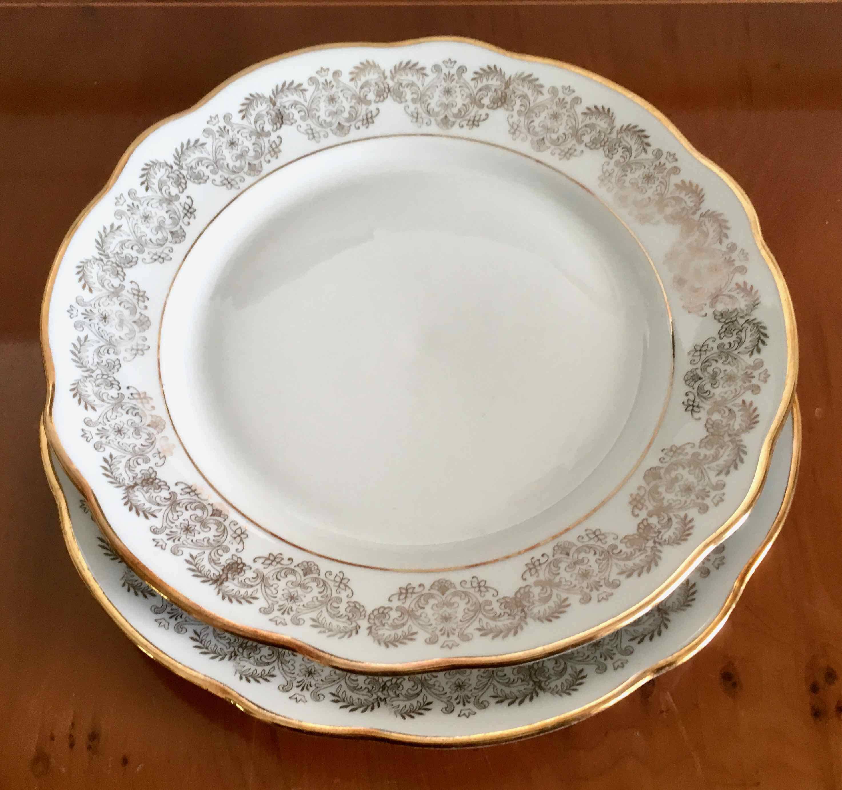8 white and gold porcelain dessert plates