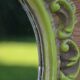 Small green wooden mirror