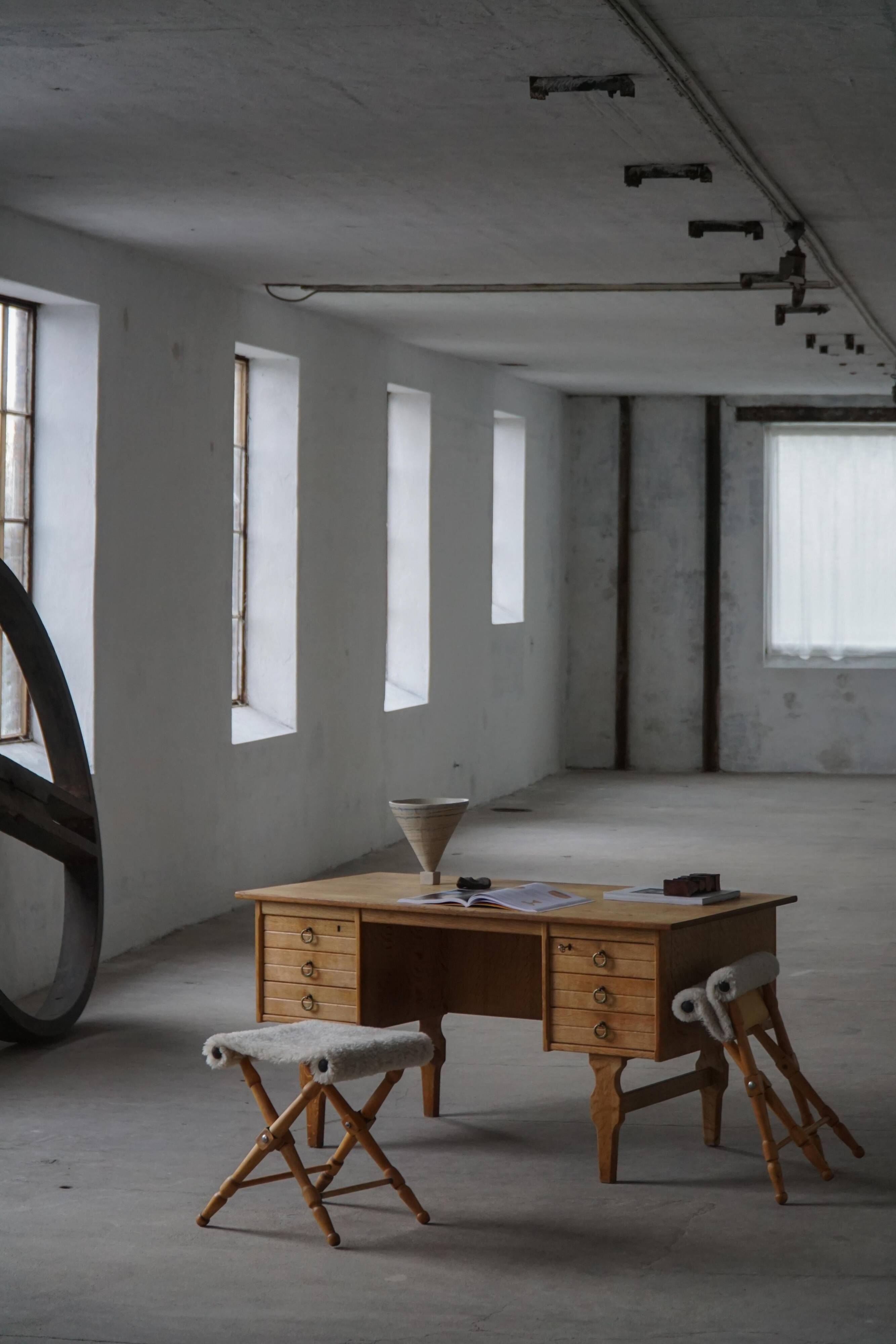 Pair of Danish mid-century folding stools with sheepskin upholstery, 1960.