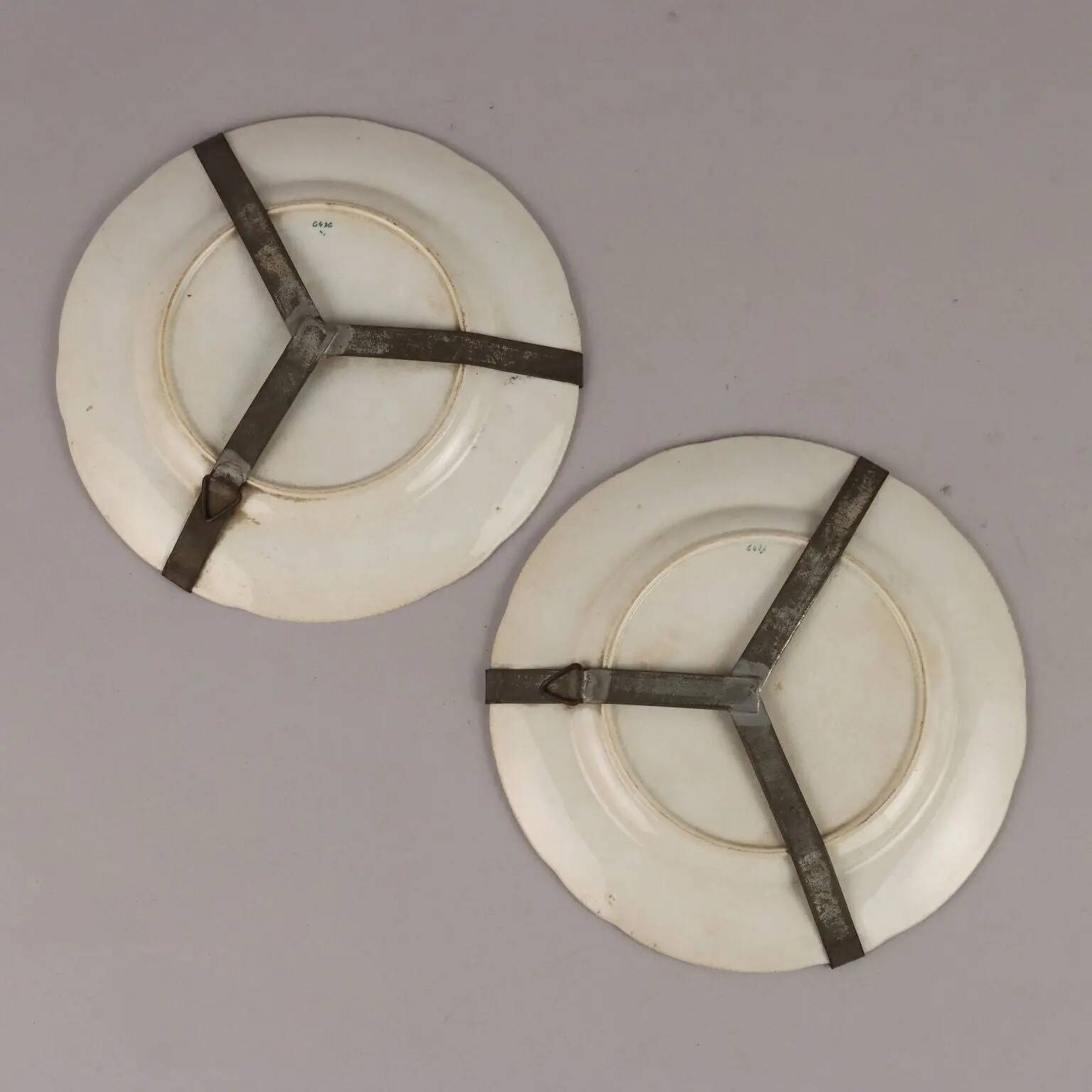 Antique earthenware plates with floral decoration from the 19th century.