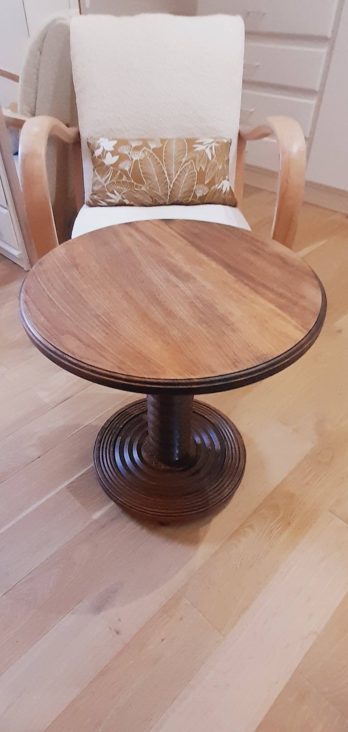 Brutalist side table with turned wood and wine press leg.