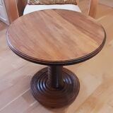 Brutalist side table with turned wood and wine press leg.