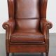 Fauteuil à oreilles de style anglais en cuir de vachette