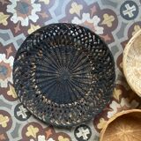 Set of 7 black and natural wicker baskets.