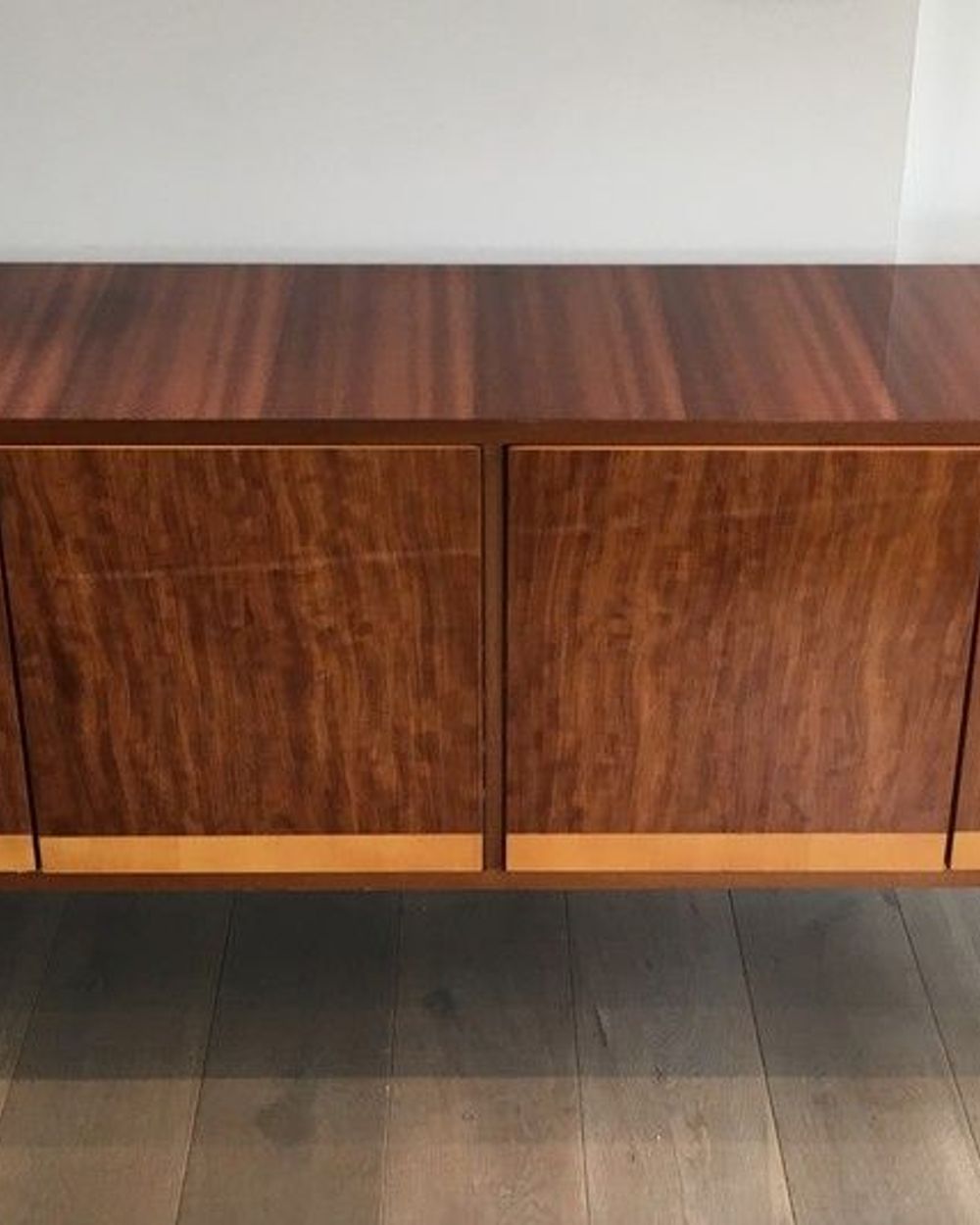 Mahogany enfilade on a blackened wooden base