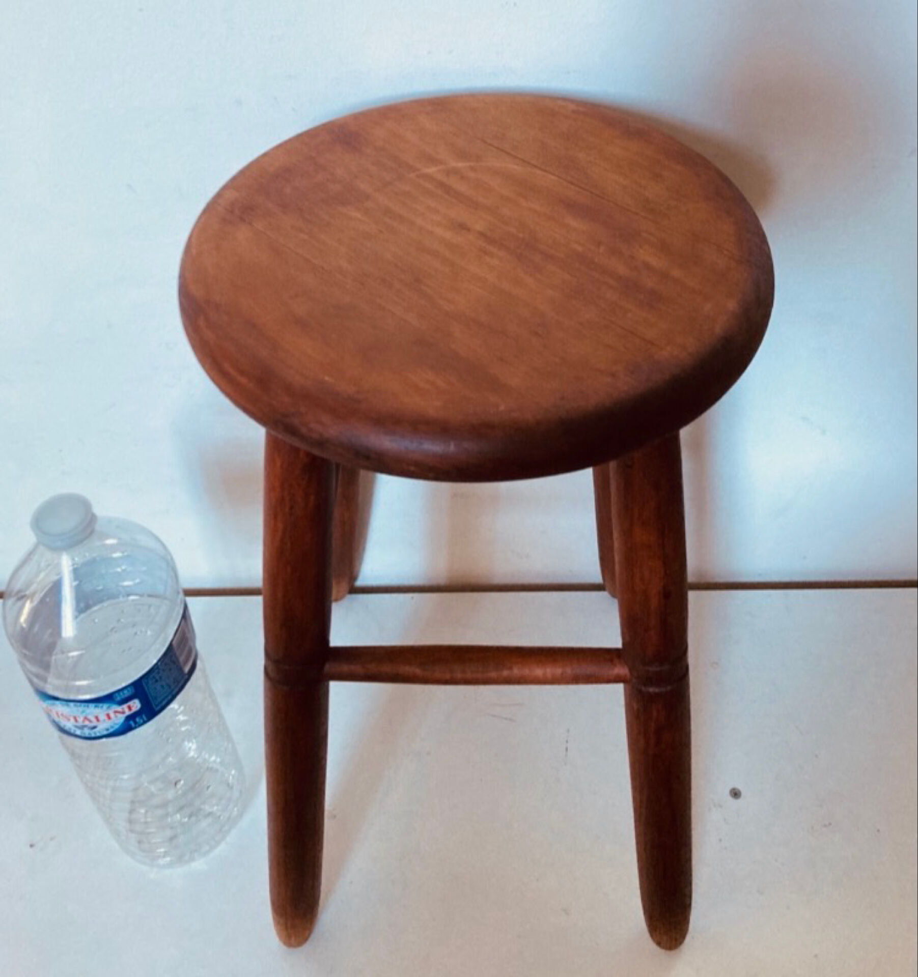 Vintage four-legged stool made of solid wood from the 1970s/80s.