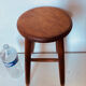 Vintage four-legged stool made of solid wood from the 1970s/80s.