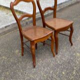 2 Louis Philippe caned chairs from the 19th century in solid wood.