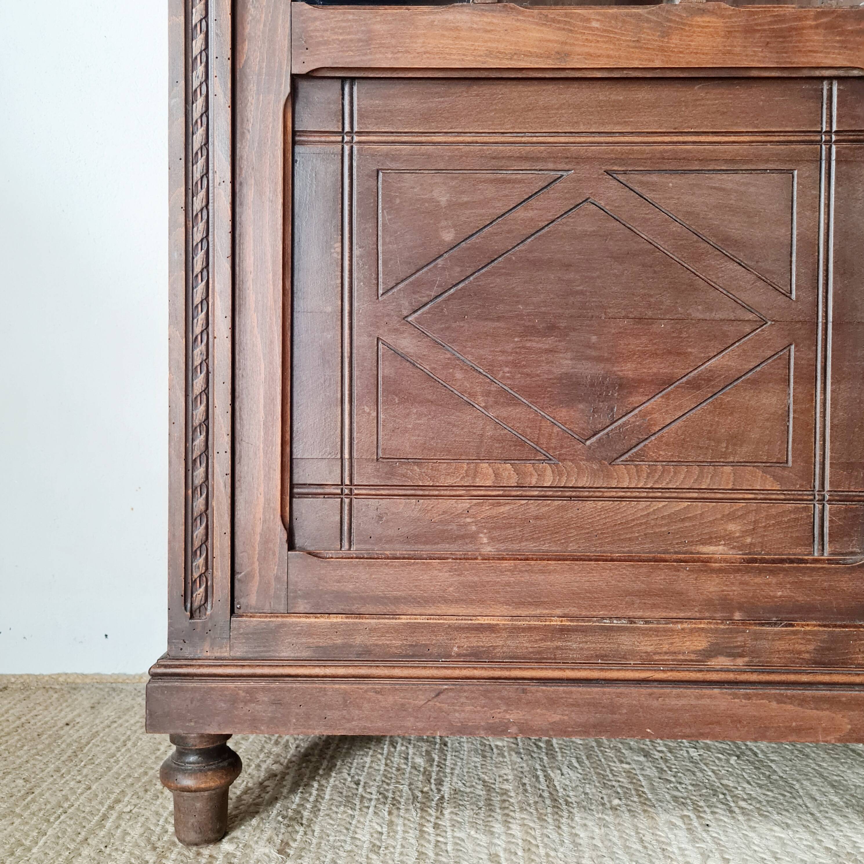 Old glass-fronted library in solid wood