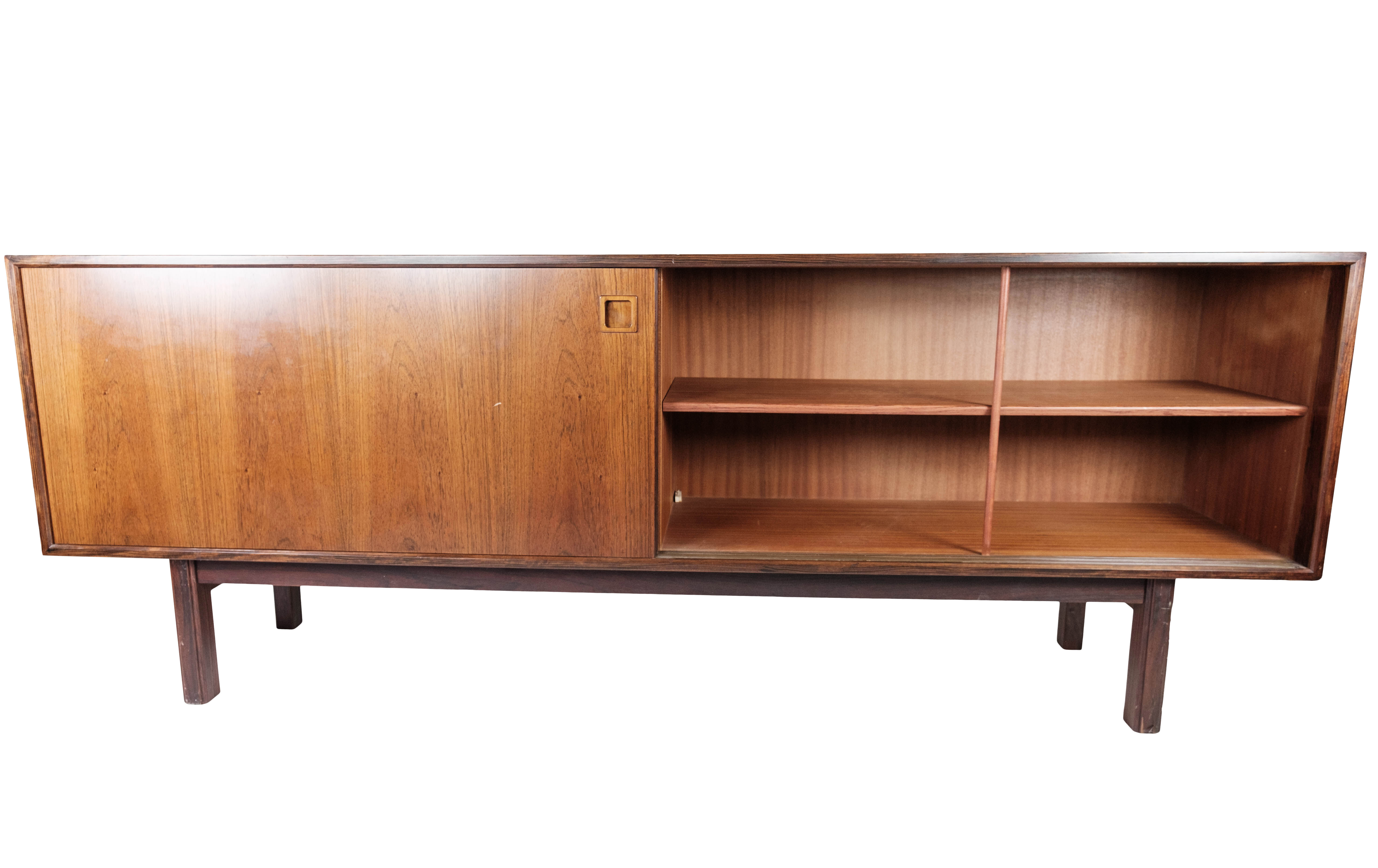 Sideboard in rosewood with sliding doors designed by Omann Junior from the 1960s.