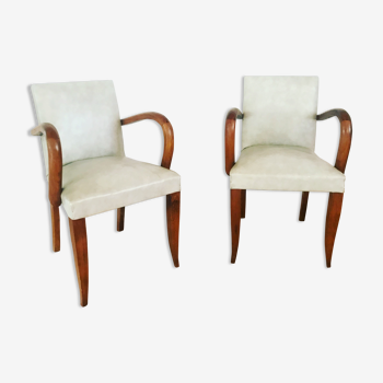 Pair of vintage armchairs in wood and imitation leather