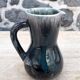 Enamelled ceramic pitcher signed Morvan