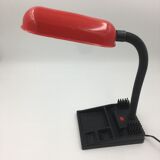 Duo of red and black flexible desk lamps with pencil holder