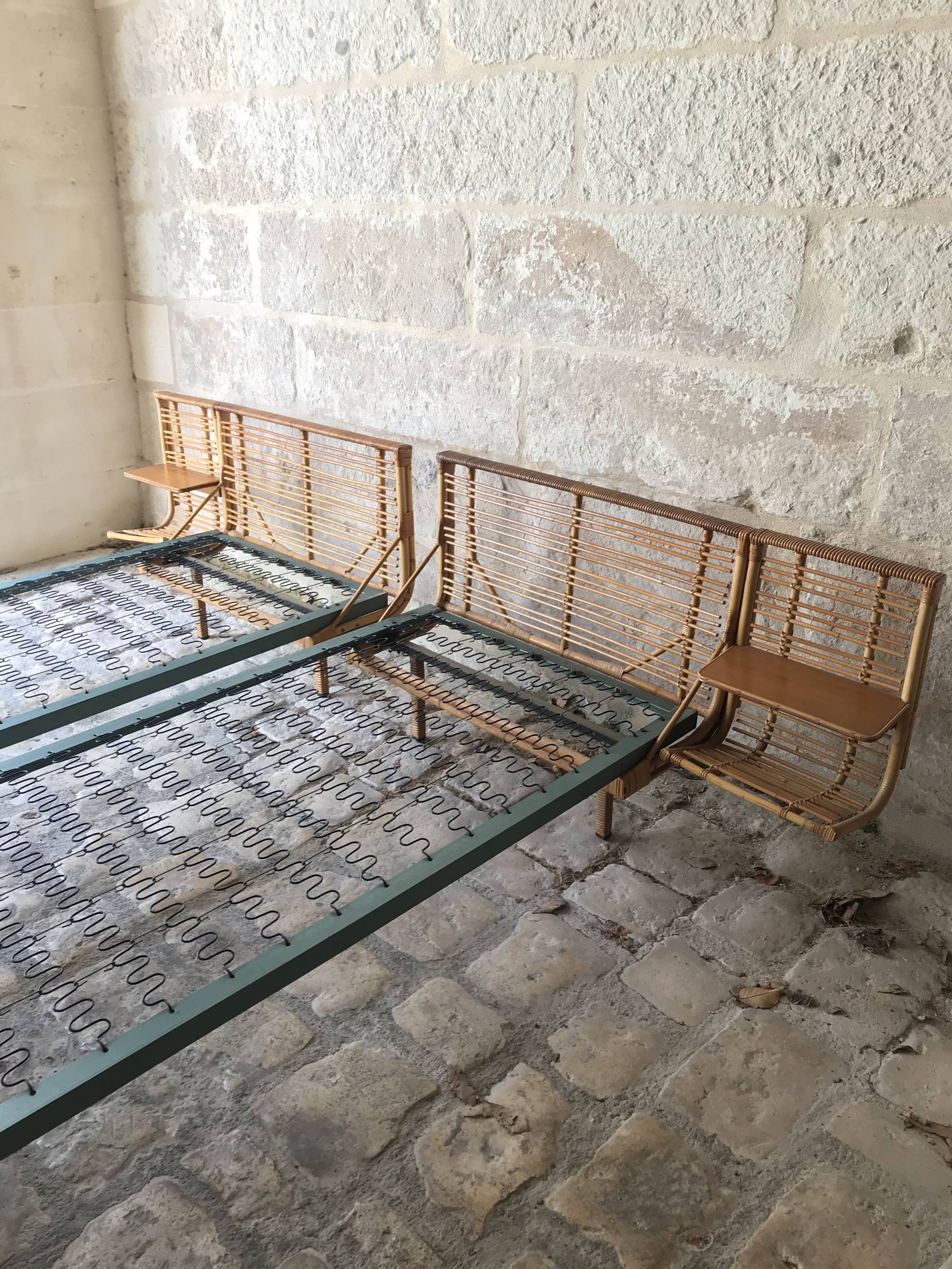 Twin rattan beds with built-in bedside tables