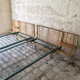 Twin rattan beds with built-in bedside tables