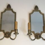 Pair of mirror and bronze wall lamps with lions' heads, french work. around 1940