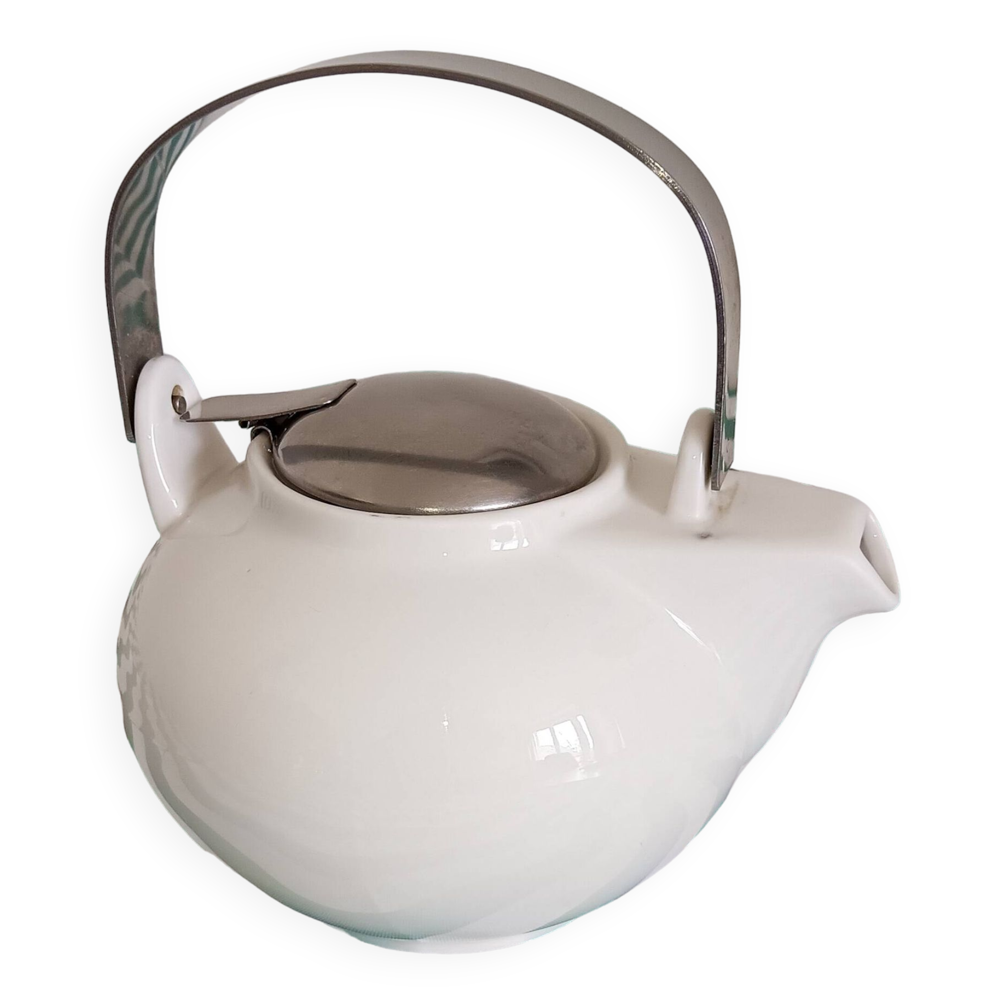 White porcelain teapot. Shiny stainless steel handle and lid
