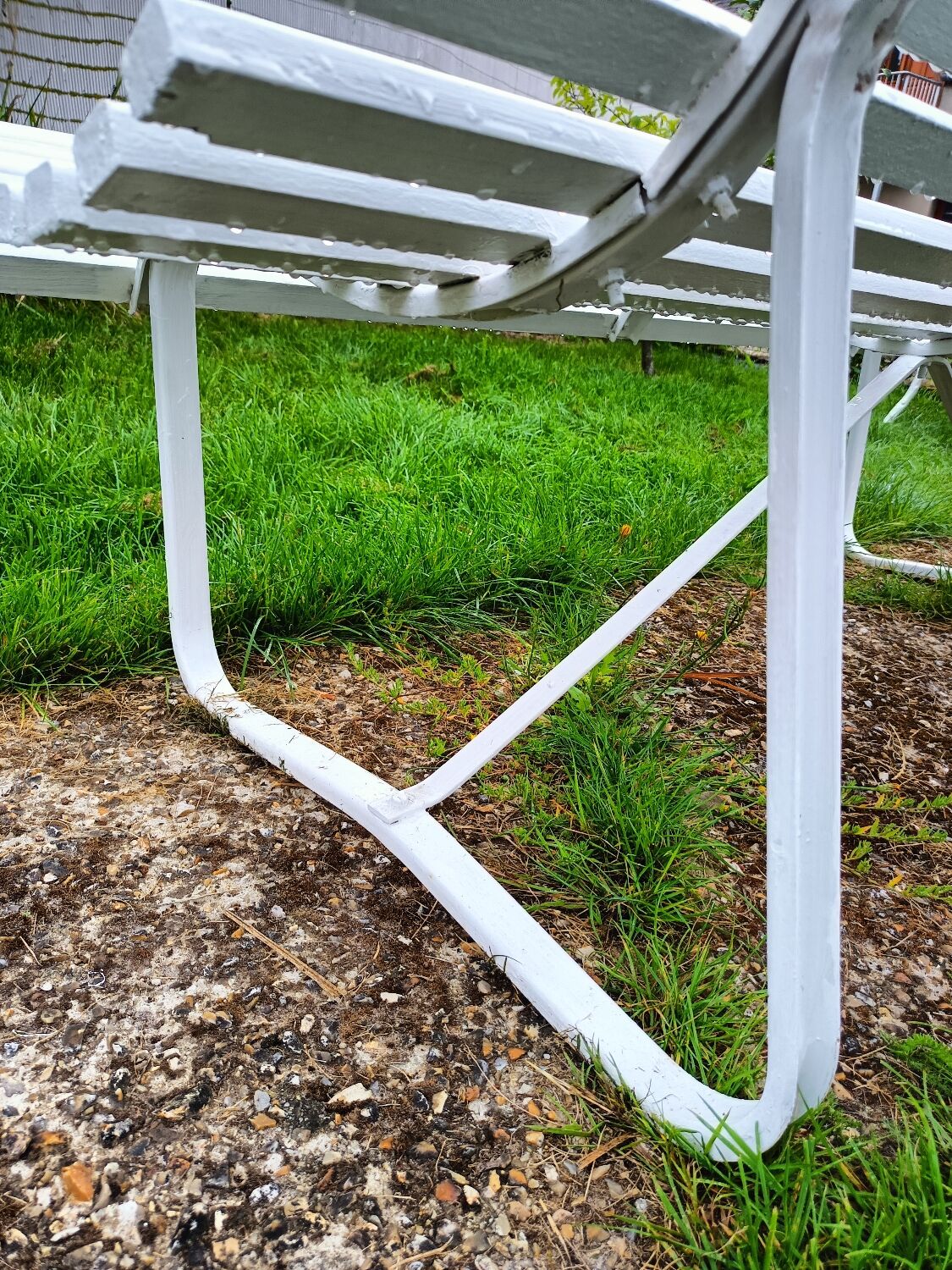 Antique garden bench with metal legs