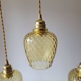 Trio of yellow glass pendant lights