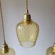 Trio of yellow glass pendant lights