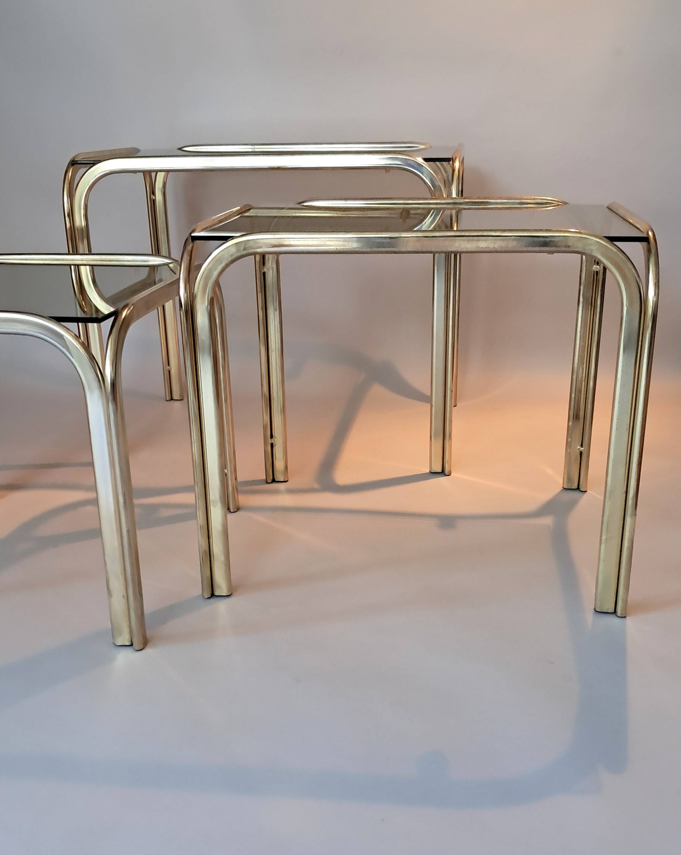 3 vintage golden nesting tables with smoked glass.