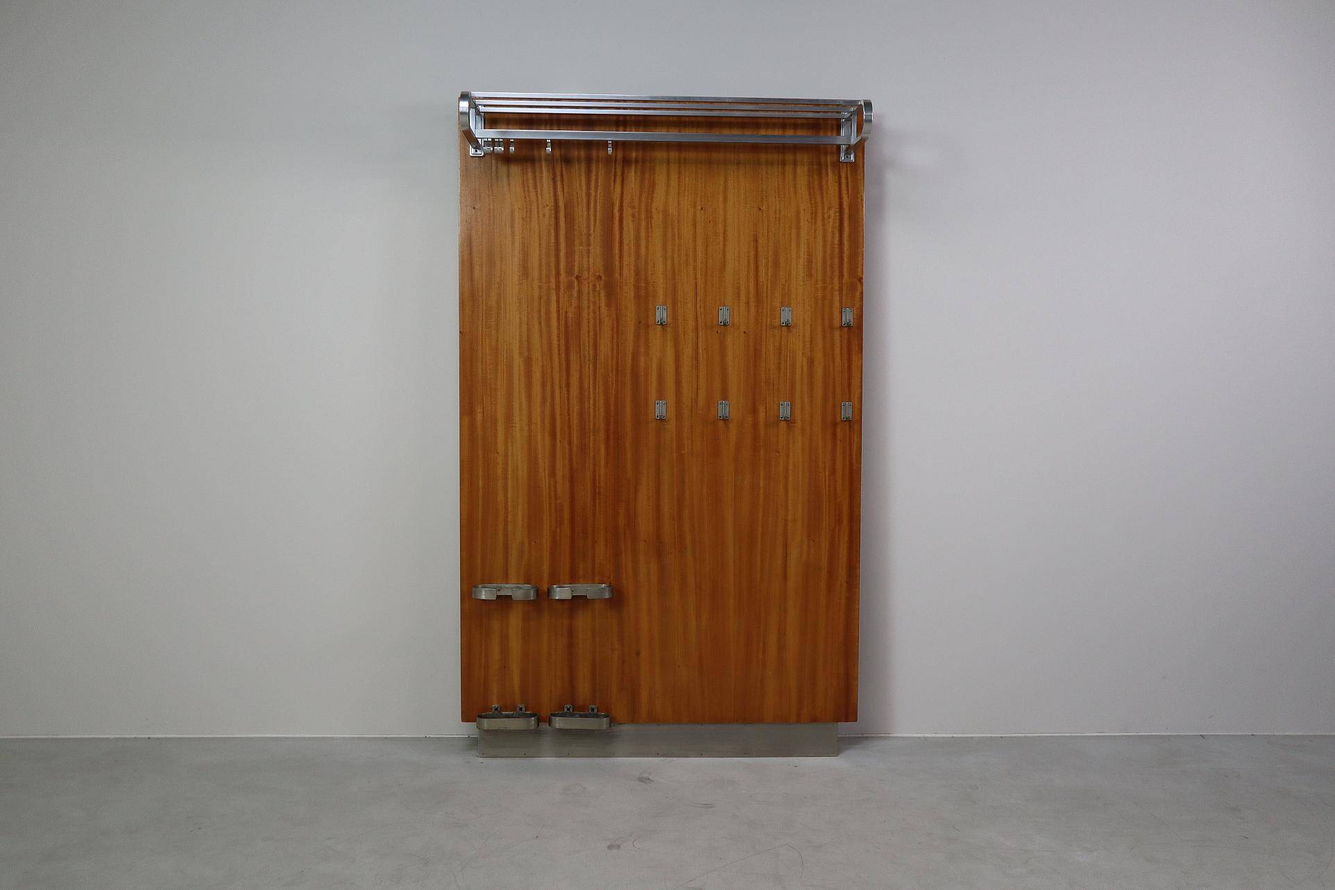 Modernist wall-mounted cloakroom in teak