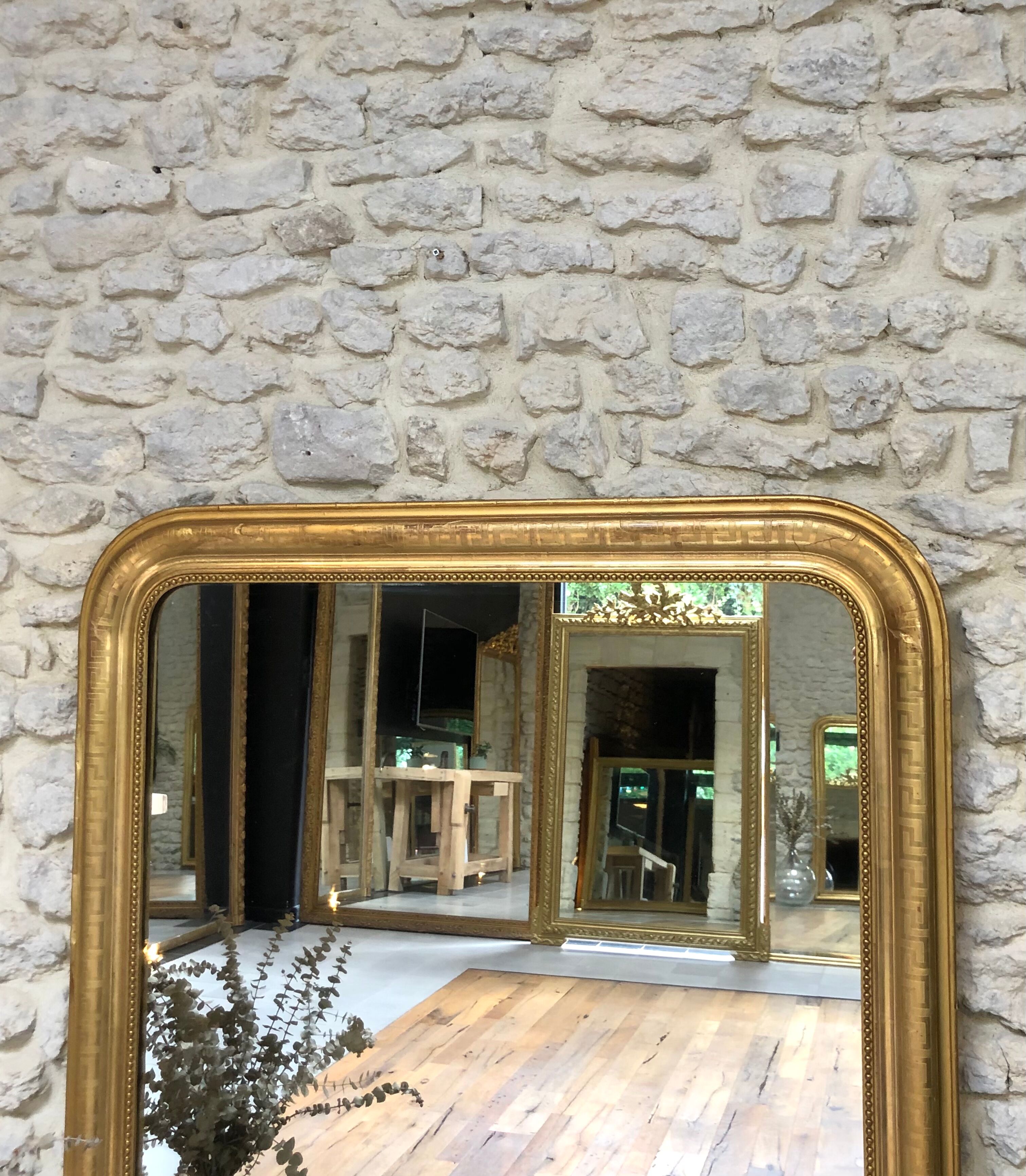 Louis-Philippe mirror pearled gold with gold leaf, some imperfections 146cm / 101cm