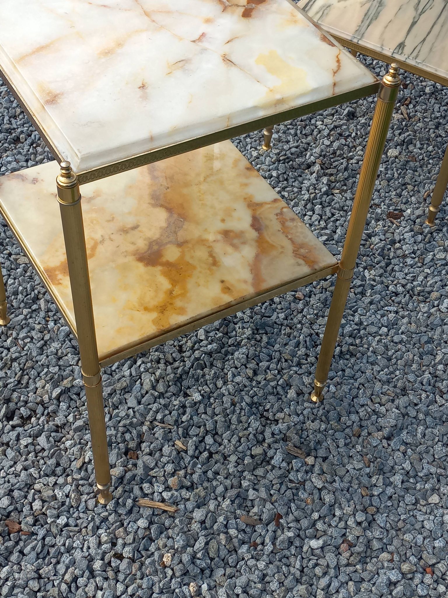Pair of neoclassical side tables in bronze, brass, marble, and o.
