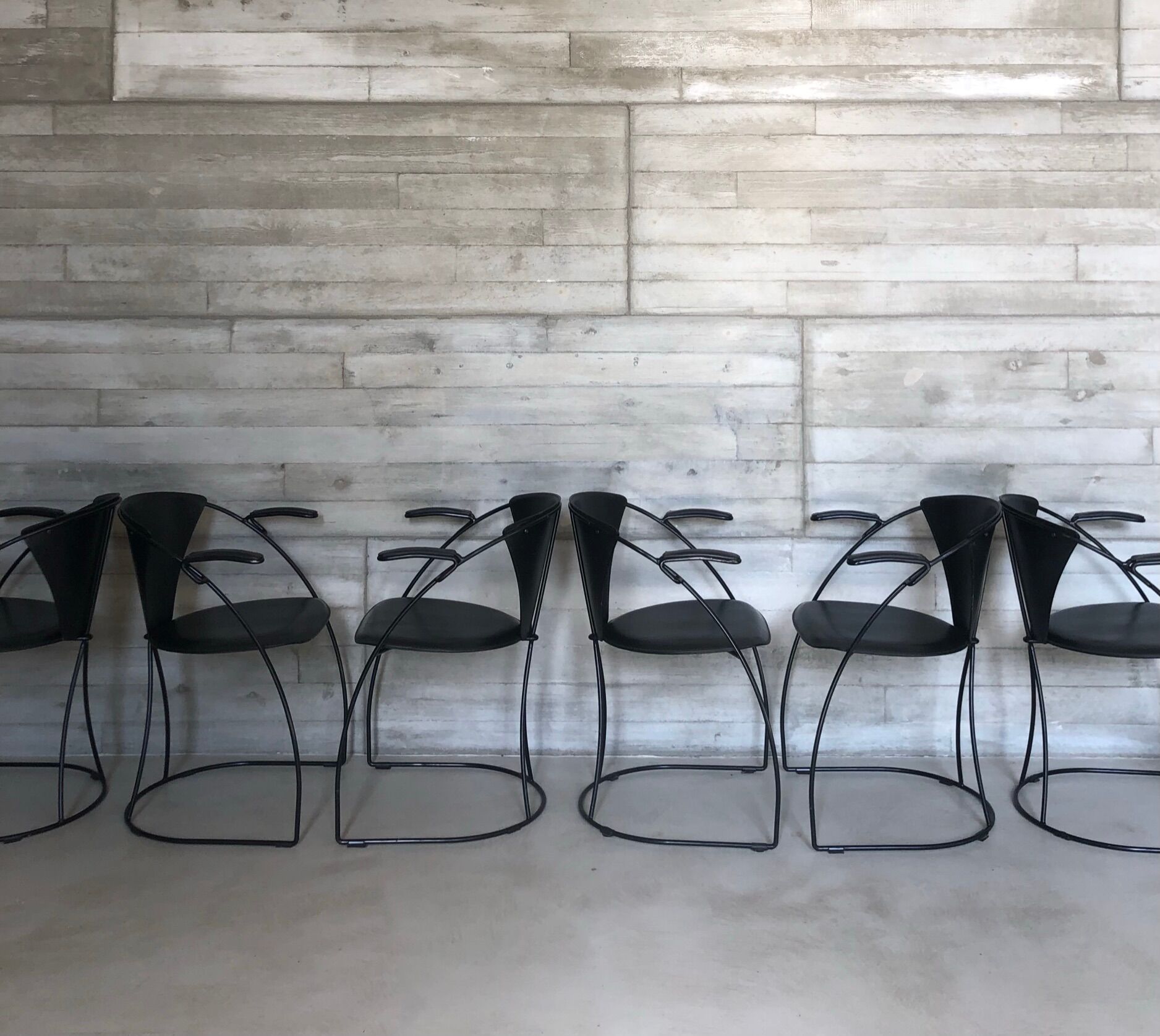 “Armlinda” black leather dining chairs by Arrben Italy